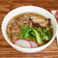 U2. Beef Udon · Udon noodles in classic dashi (fish) based soup with beef topping