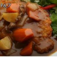 P6. Pork Katzu Curry Platter · Fried pork served with curry on top. Platter comes with rice and salad.