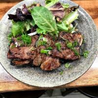 P12. Kalbi Platter · Korean-style grilled short ribs, served with rice and salad.