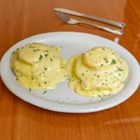Eggs Benedicts · Poached eggs on English muffin with ham with hollandise sauce.