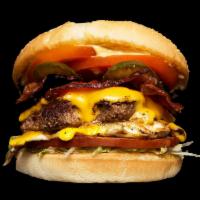Barnyard Burger · Bacon, ham, egg, American, lettuce, tomato, house sauce, grilled onion and pickle. Comes wit...