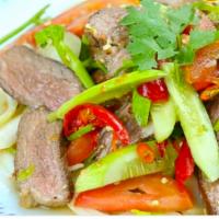 Beef Salad · Grilled beef tossed with cucumber, and onion cooked with spicy lime juice.