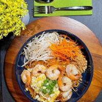 Pad Thai Noodles · Pan-fried rice noodles with egg, bean sprouts and ground peanuts topped with green onions.