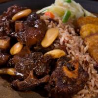 Oxtail Combo with Rice, Peas, Plantains · Succulent, slow-cooked, tender braised oxtail in a rich gravy that will make your rice and p...