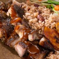 Jerk Pork Meal · Pork marinated and slow-roasted in Jamaican jerk seasoning. With steamed vegetables and choi...