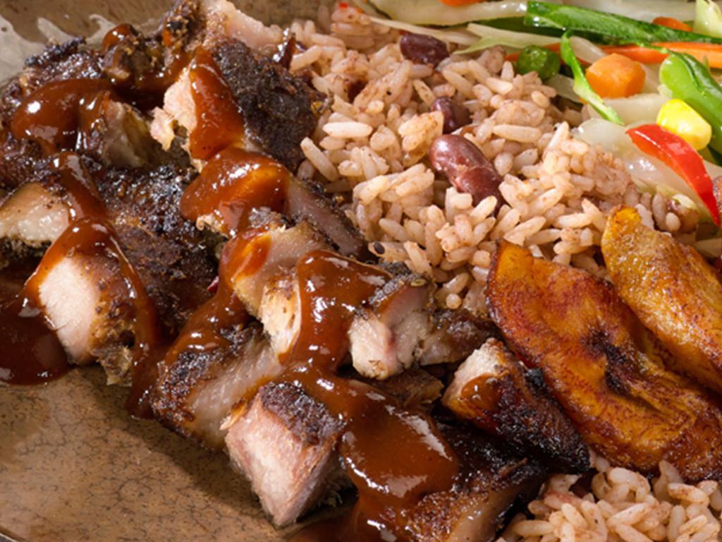 Jerk Pork Meal · Pork marinated and slow-roasted in Jamaican jerk seasoning. With steamed vegetables and choice of rice.