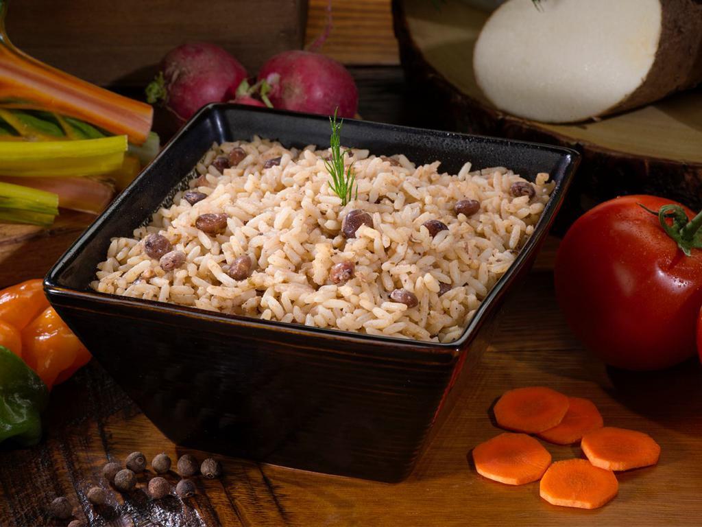 Rice and Peas · Seasoned with thyme, garlic, and a blend of spices, this pairs perfectly with our stews, oxtail and jerk dishes.