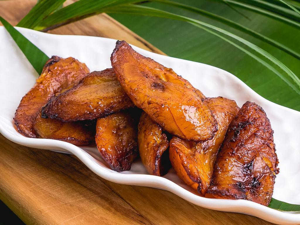 SD Fried Plantains (6pcs) · These sweet ripe plantains are sliced and fried to perfection, leaving them crisp on the outside and soft on the inside.
