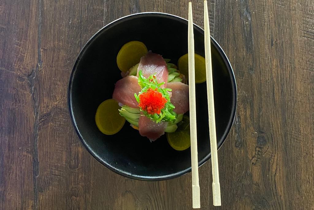 Tuna Bowl · Spicy tuna, seaweed salad, avocado, pickled radish, sesame seeds with eel sauce and spicy mayo over rice.