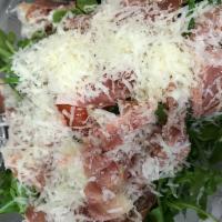 Arugula Prosciutto Salad · Arugula, prosciutto, tomatoes, Parmesan, balsamic dressing.