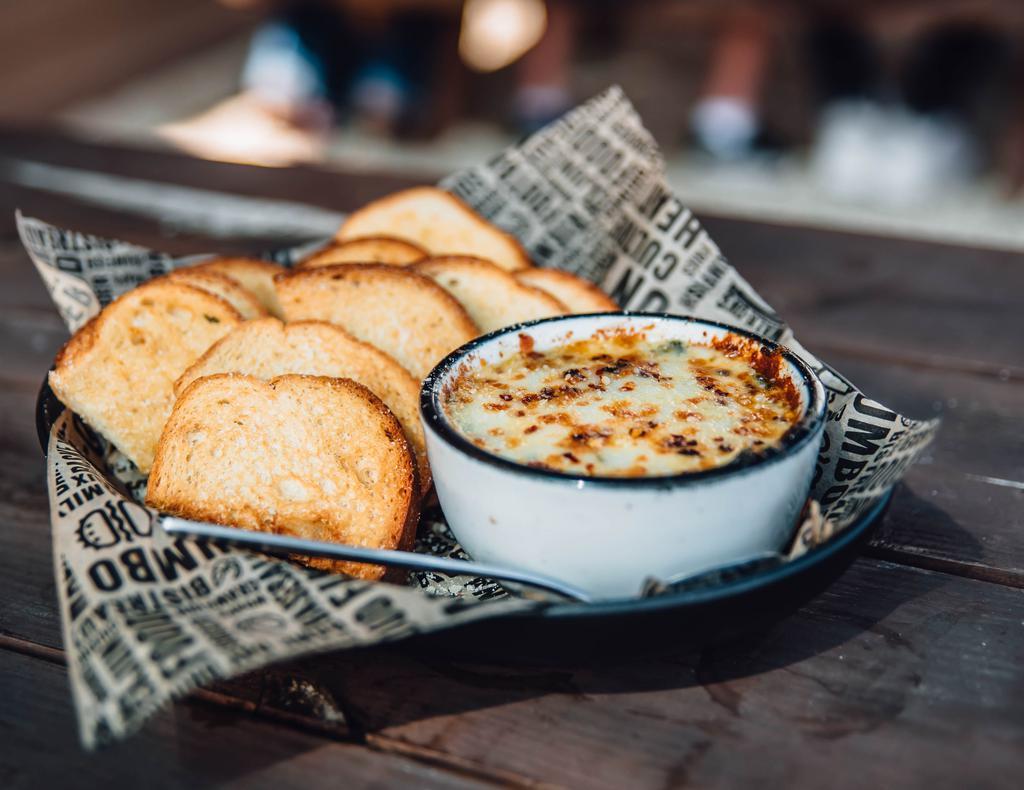 Spinach & Artichoke Dip · Served with toast points or tortilla chips.