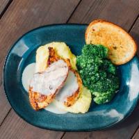 Lemon Butter Chicken · Grilled chicken breasts, lemon butter, corn grits and broccoli.