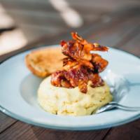 Voodoo Shrimp & Grits · Chargrilled shrimp, cream cheese, pickled jalapenos, wrapped in bacon, corn grits and sweet ...