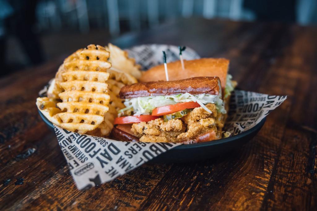 Fried Catfish Poboy · Seafood poboys dressed with lettuce, tomatoes, mayo and pickles.