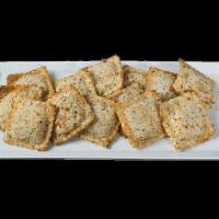 Toasted Beef Ravioli · Hand-breaded ravioli stuffed with ground beef and baked. Includes choice of dipping sauce.