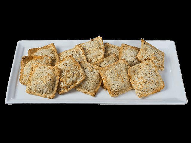Toasted Beef Ravioli · Hand-breaded ravioli stuffed with ground beef and baked. Includes choice of dipping sauce.
