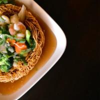 Double Pan Fried Noodles · Sautéed fresh mixed vegetables with brown sauce in a crispy egg noodle nest.