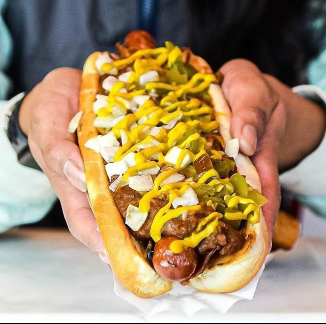 Diablo Dog · All beef hot dog wrapped in bacon and deep fried, chili, shredded cheese, mustard, jalapenos & diced onions