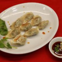 46. Dumplings (crispy pan fried) · 6 pieces of pork dumplings