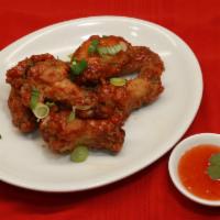 57. Canh Ga Chien · Vietnamese chicken wings. Deep-fried chicken wings. Sweet Chili Sauce