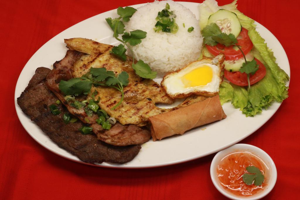 23. Com Dac Biet · Special plate combination, grilled beef, pork, chicken, fried egg & Vietnamese egg roll.