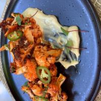 Buffalo Cauliflower - NEW! · Roasted cauliflower over buffalo sauce, and served with blue cheese sauce.