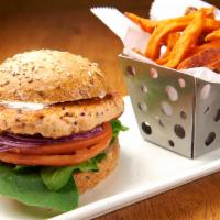 Salmon Burger · Baby spinach, tzatziki sauce, tomatoes and onions.