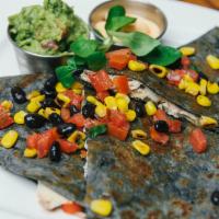 Chicken Quesadilla · Shredded chicken, peppers,  and melted white cheese on black bean tortilla, served with guac...