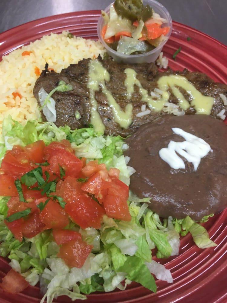 Churrasco Plate · Grilled marinated steak with rice, beans, homemade tortillas, and choice of side.