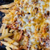 Mexican Fries · Curly fries with melted pepper Jack cheese and bacon bits and Jalapeños. 