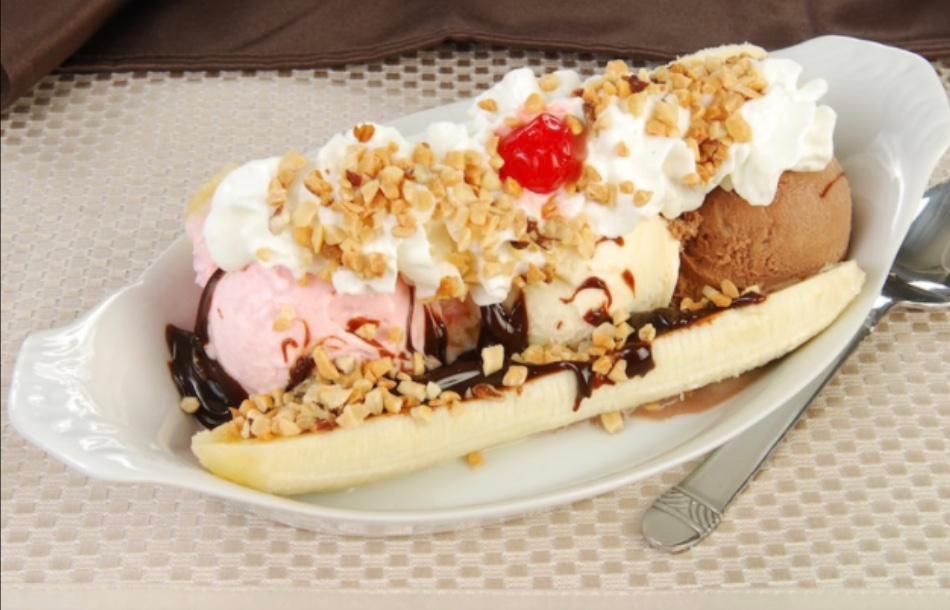 Banana Split Breyer’s IceCream  · Three scoops of Breyer’s ice cream chocolate vanilla and strawberry with a whole banana topped with Hershey’s chocolate  syrup and peanuts