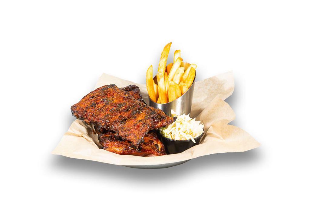 Old Bay BBQ Ribs · Slow-smoked & grilled St. Louis style pork ribs basted with smoky BBQ sauce and dusted with Old Bay®, served with fries and house slaw
