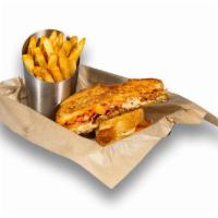 Crabby Melt · World famous crab dip, melted cheddar, tomato, bacon, Old Bay®, griddled sourdough