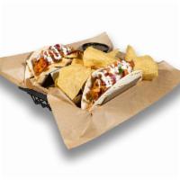 Buffalo Chicken Tacos · Hand-breaded tenders, kinda hot sauce, house slaw, pico de gallo, ranch drizzle