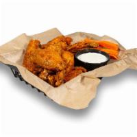 Bone-in Wings · 100% all-natural chicken wings tossed in our signature sauces and dry rubs