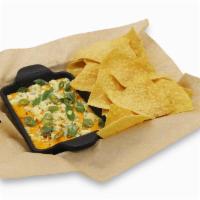 Buffalo Chicken Dip · Buffalo chicken dip, bleu cheese crumbles, scallions, tortilla chips