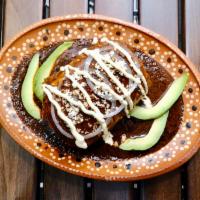 Poblano Chicken Burrito (Mole) · Speciality burrito covered in mole sauce (Mexican chocolate chile sauce) with grilled chicke...