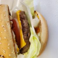 Cheeseburger · All fresh grounded Beef marinated in rich flavorful spicy and hand made patties on a large t...