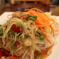 Som Tum Goong Salad (Gluten-Free) · Mildly spiced. Shrimp papaya salad. Shredded green papaya salad with tiger prawns, cherry to...