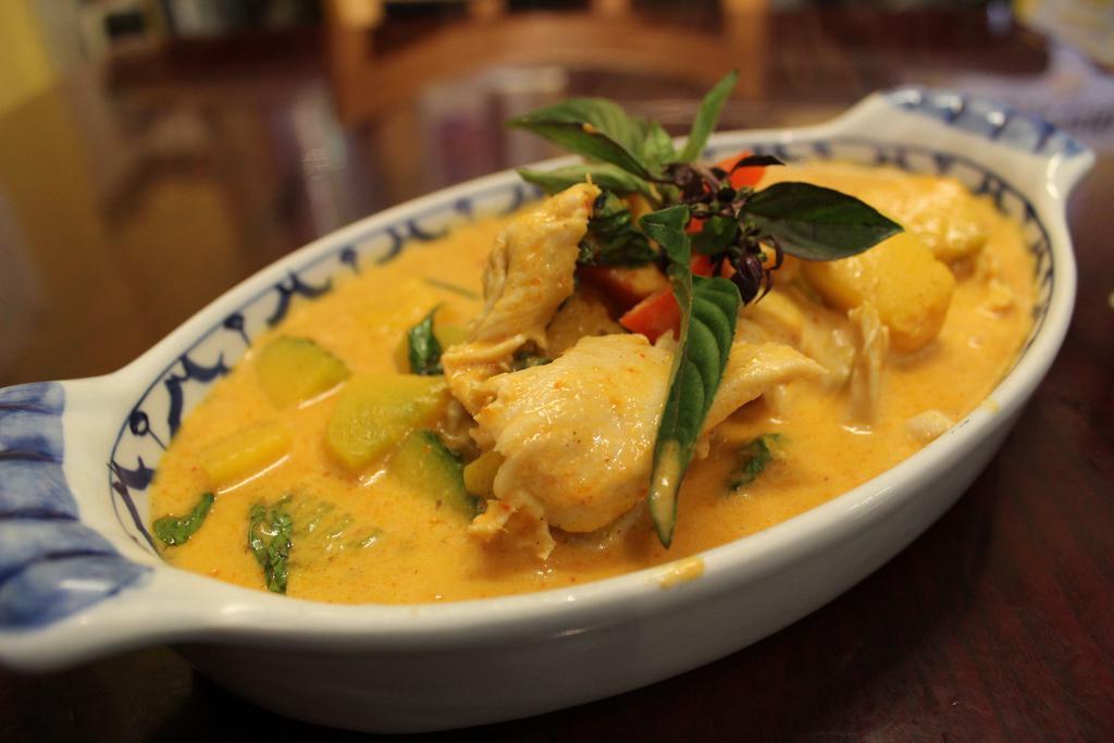 38. Pumpkin Curry · Gluten-free. Choice of spice level. Choice of style. Red curry with pumpkin, red bell peppers, and fresh basil.