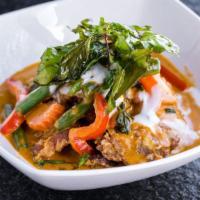 Panang Crispy Duck · Choice of spice level. Crispy duck over panang curry sauce top with coconut milk.