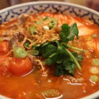 44. Khaknom Jin Nam Ngiao · Gluten-free. Choice of spice level. Special pork tomato broth soup served with round rice no...