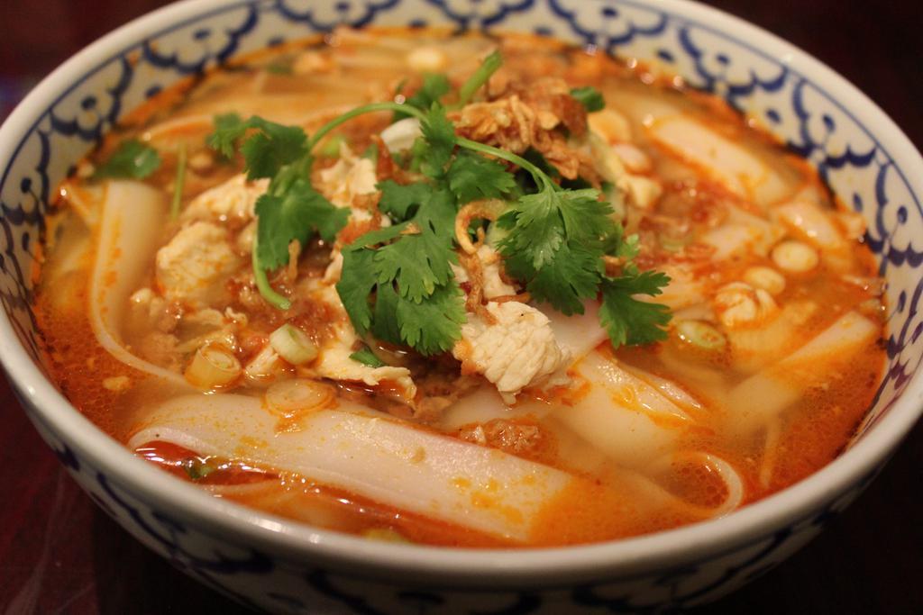 49. Kao Soy Laos · Gluten-free. Laos style pork broth soup served with wide noodles, chicken, bean sprouts, and cabbage.