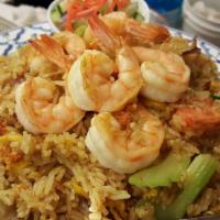 67. Kao Pad Goong Ga-Ree · Fried rice with yellow curry powder, shrimp, onions, celery, and egg served with cucumber sa...