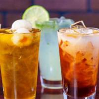 Lychee Thai Tea · Thai style sweetened tea served with lychee fruit over ice.