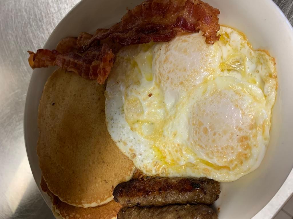 1. Pancake Combo · 2 fluffy pancakes, 2 eggs, 2 sausage links and 2 bacon strips.