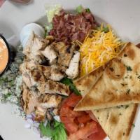 Cobb Salad · Chopped lettuce, bacon, tomato, egg, cheddar cheese, red onion, crumbled blue cheese and gri...