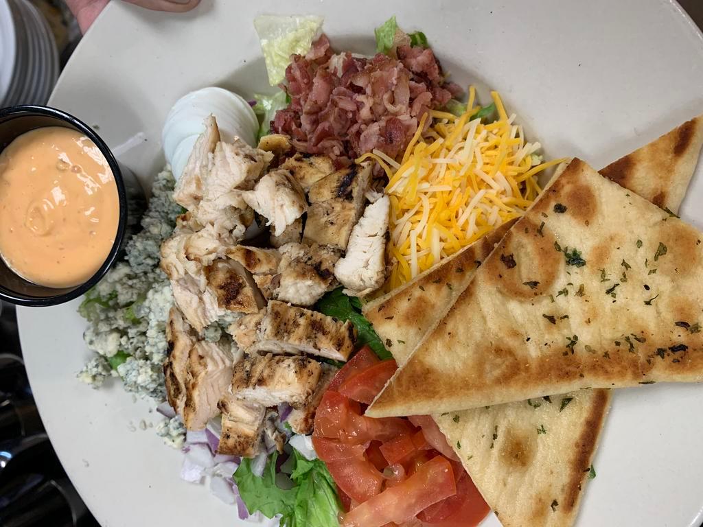 Cobb Salad · Chopped lettuce, bacon, tomato, egg, cheddar cheese, red onion, crumbled blue cheese and grilled chicken breast.