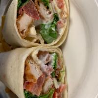 Chicken Bacon Ranch Wrap · Chicken tenders, tomato, bacon, lettuce and ranch dressing in a flour tortilla.