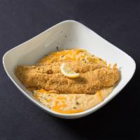 Fish and Grits · Seared or fried fillet served over our creamy cheesy garlic grits.